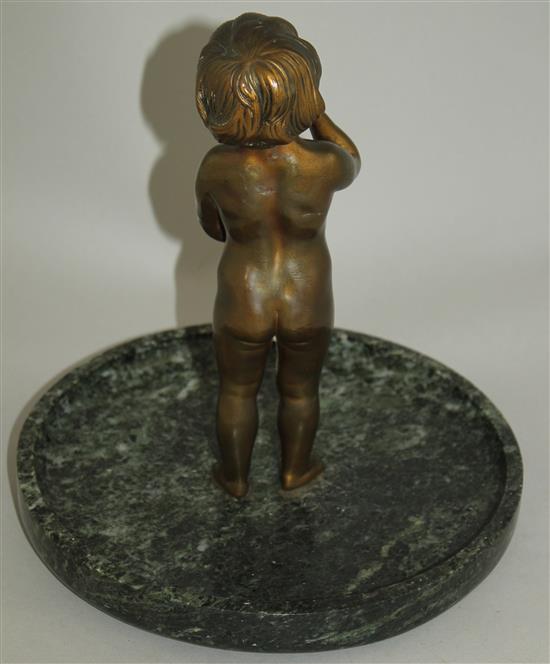 An early 20th century patinated bronze of a small child standing holding a letter, 9ins wide